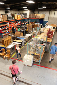 Customers purchase used items from Iowa State Surplus sale. 