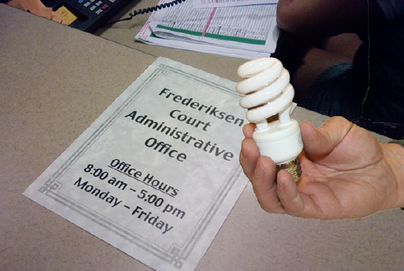 A person holding a lightbulb