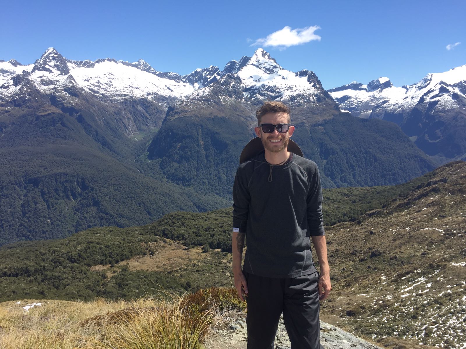 Adam Blake Wright in front of a mountain range in Australia. 