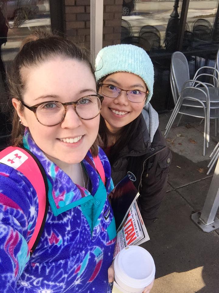 Two students in selfie at Ames Coffee shop. 