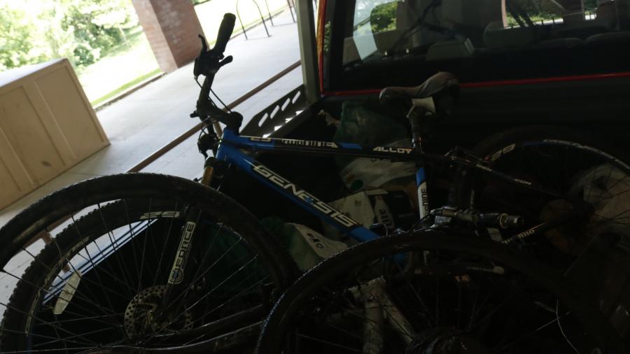 A pile of items found in College Creek, include a bike, large tire and landscape edging. 